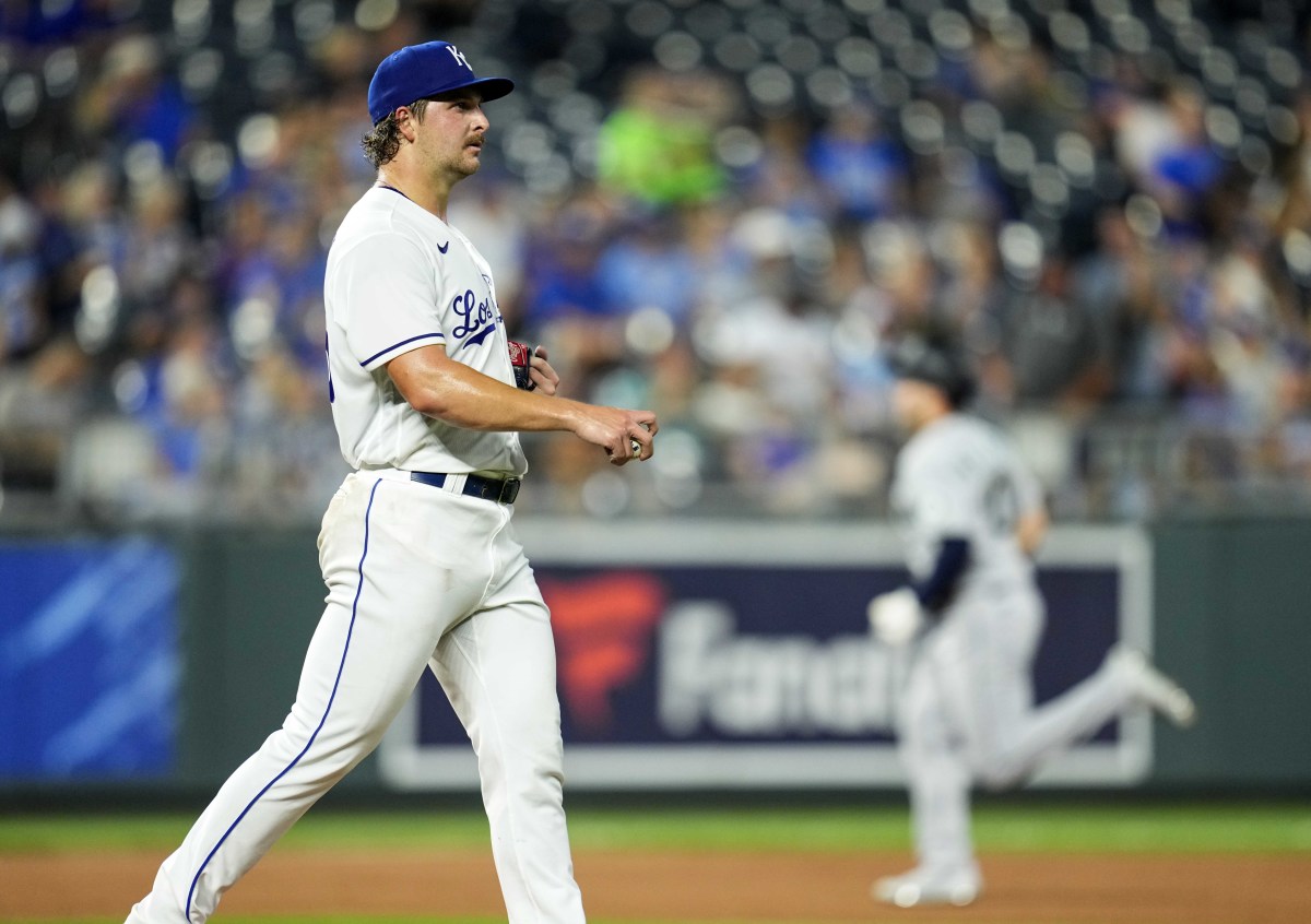 Sep 17, 2021; Kansas City, Missouri, USA; Kansas City Royals starting pitcher Jon Heasley (left) reacts after giving up a two-run home run to Seattle Mariners center fielder Jarred Kelenic (right) during the fourth inning at Kauffman Stadium. Mandatory Credit: Jay Biggerstaff-USA TODAY Sports